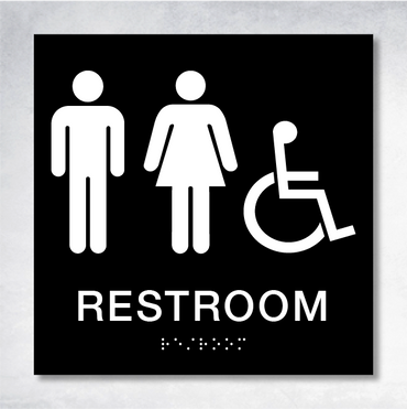 ADA compliant restroom signage featuring raised text and braille, essential for meeting restroom signage requirements.